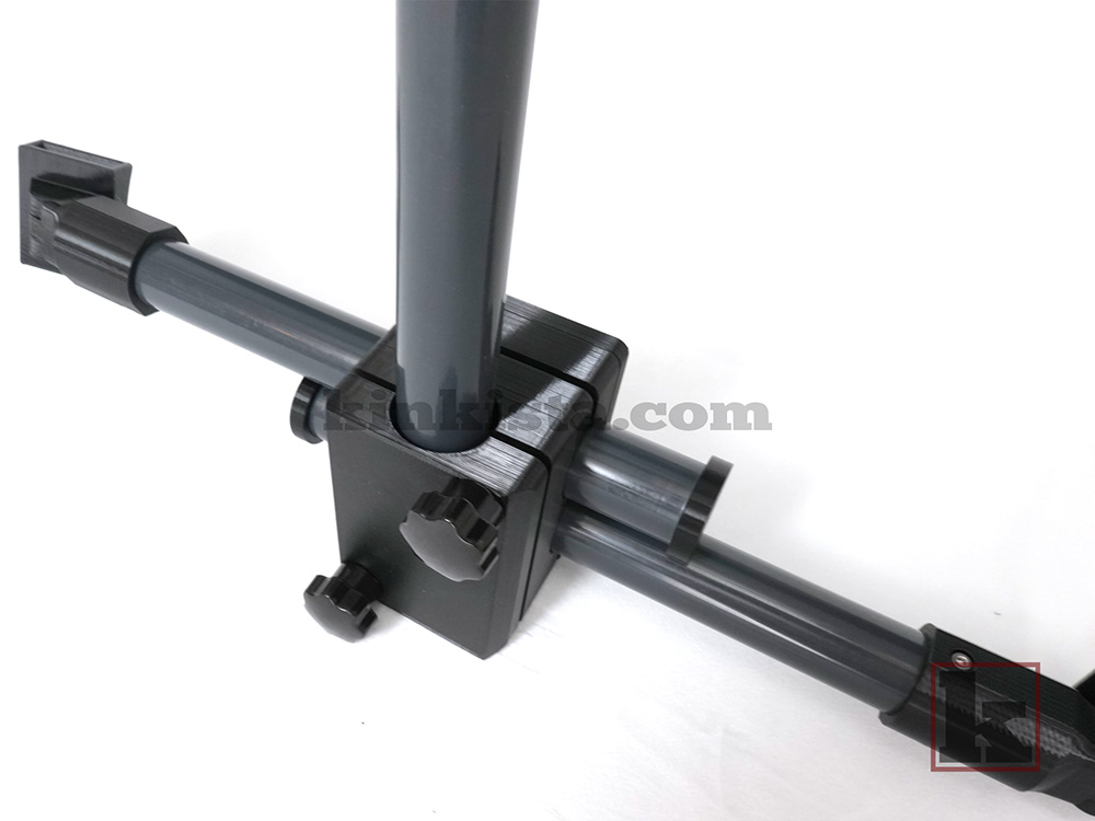 Adjustable BDSM neck-to-thigh frame with spreader bar showing restraint posture and hardware
