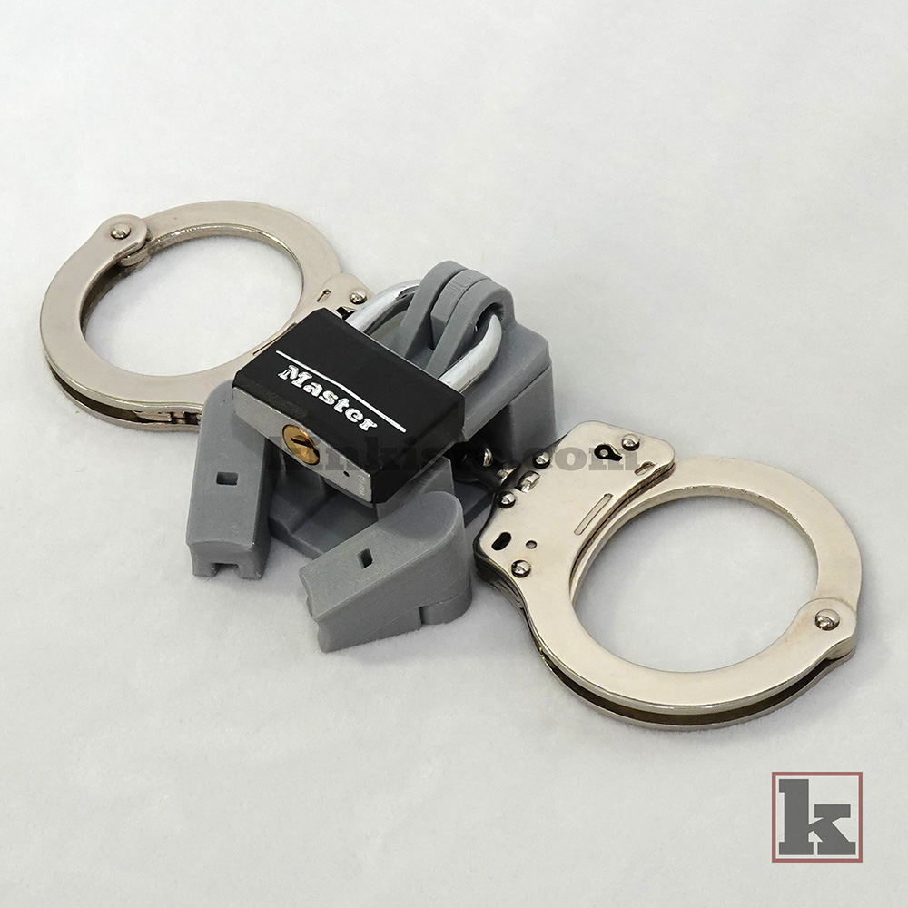 Mechanical linkage between handcuffs and cage using Anchor system