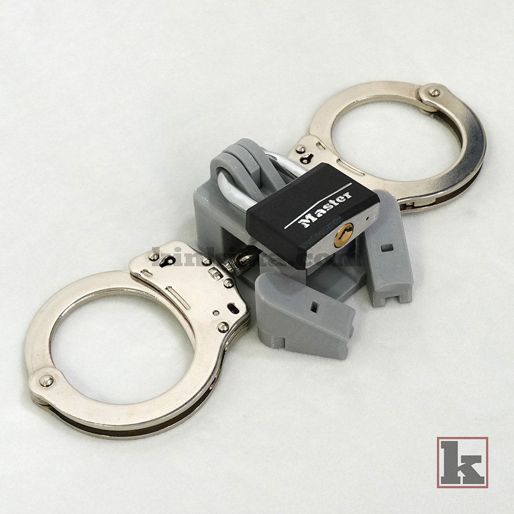 Left side view - Mechanical linkage between handcuffs and cage using Anchor system