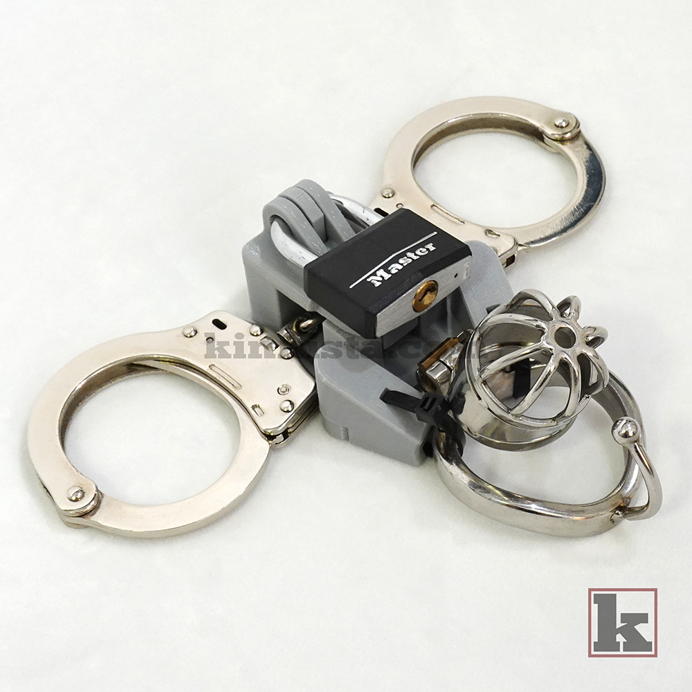 Kinkista Cuff-to-Cage Anchor attached to chastity cage base ring with dual-arm structure