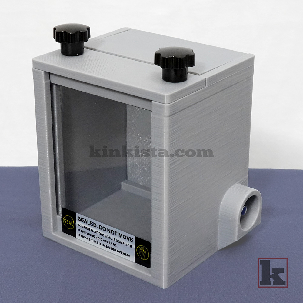 Kinkista Emergency Keybox for domestic captivity kink play, front view with clear acrylic window and VOID security label