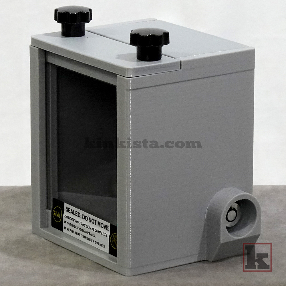 Kinkista Emergency Keybox for domestic captivity kink play, front view with clear acrylic window and VOID security label