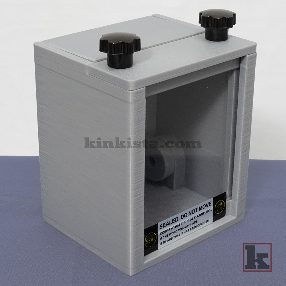 Emergency keybox holding restraint keys for Dom-controlled self-bondage and domestic captivity play