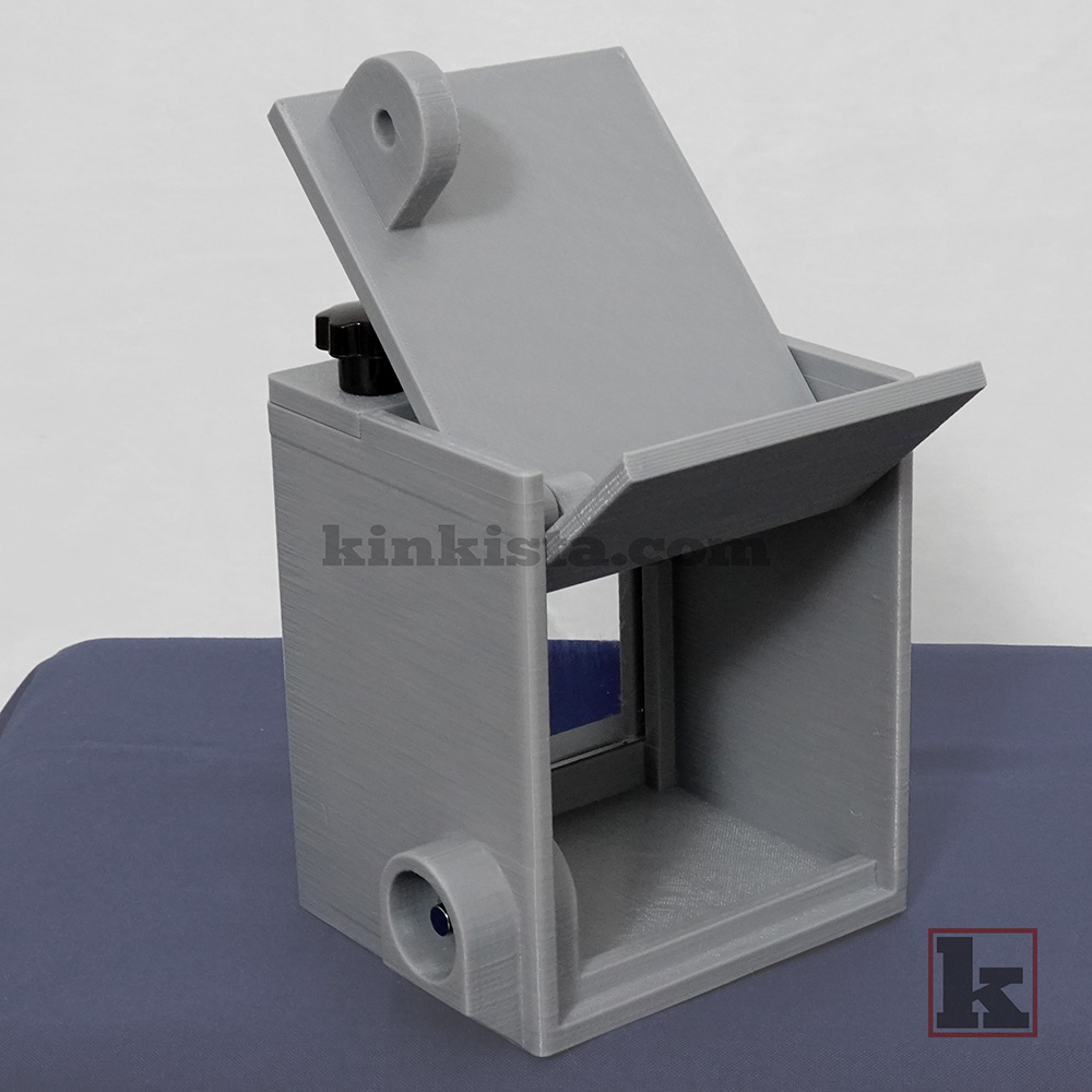 Rear view of BDSM emergency keybox with press-lock securing keys during unattended restraint scenes